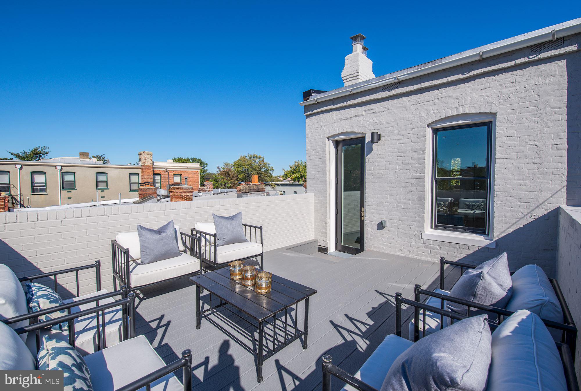 17 7th Street Southeast Washington, DC 20003 - Photo 25 of 29 a view of a patio with table and chairs with barbeque grill and plants