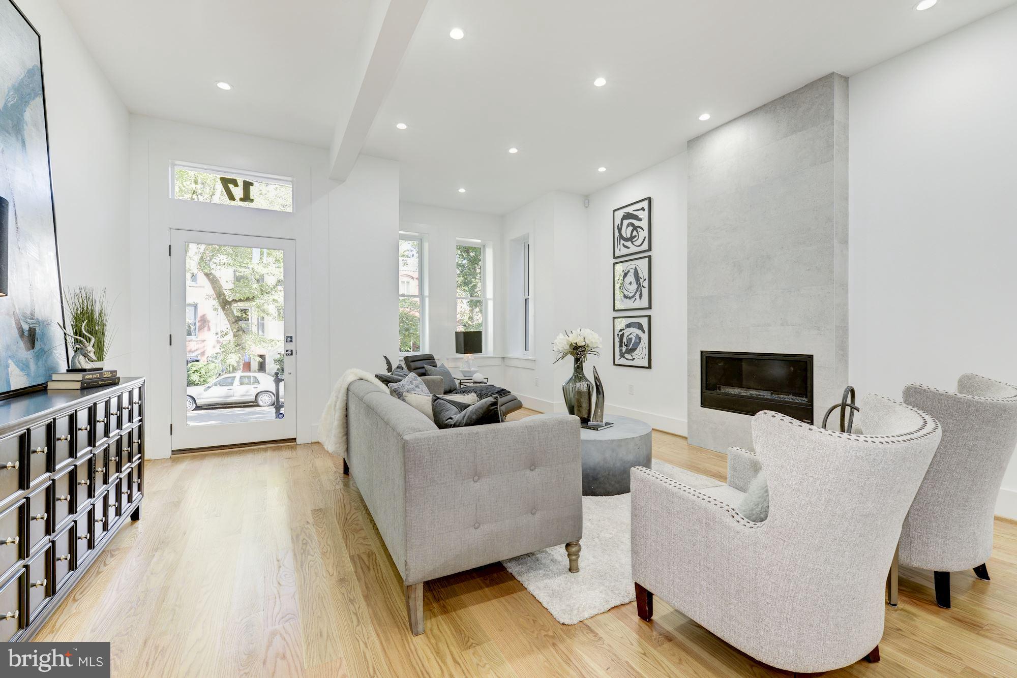 17 7th Street Southeast Washington, DC 20003 - Photo 5 of 29 a living room with furniture and a fireplace