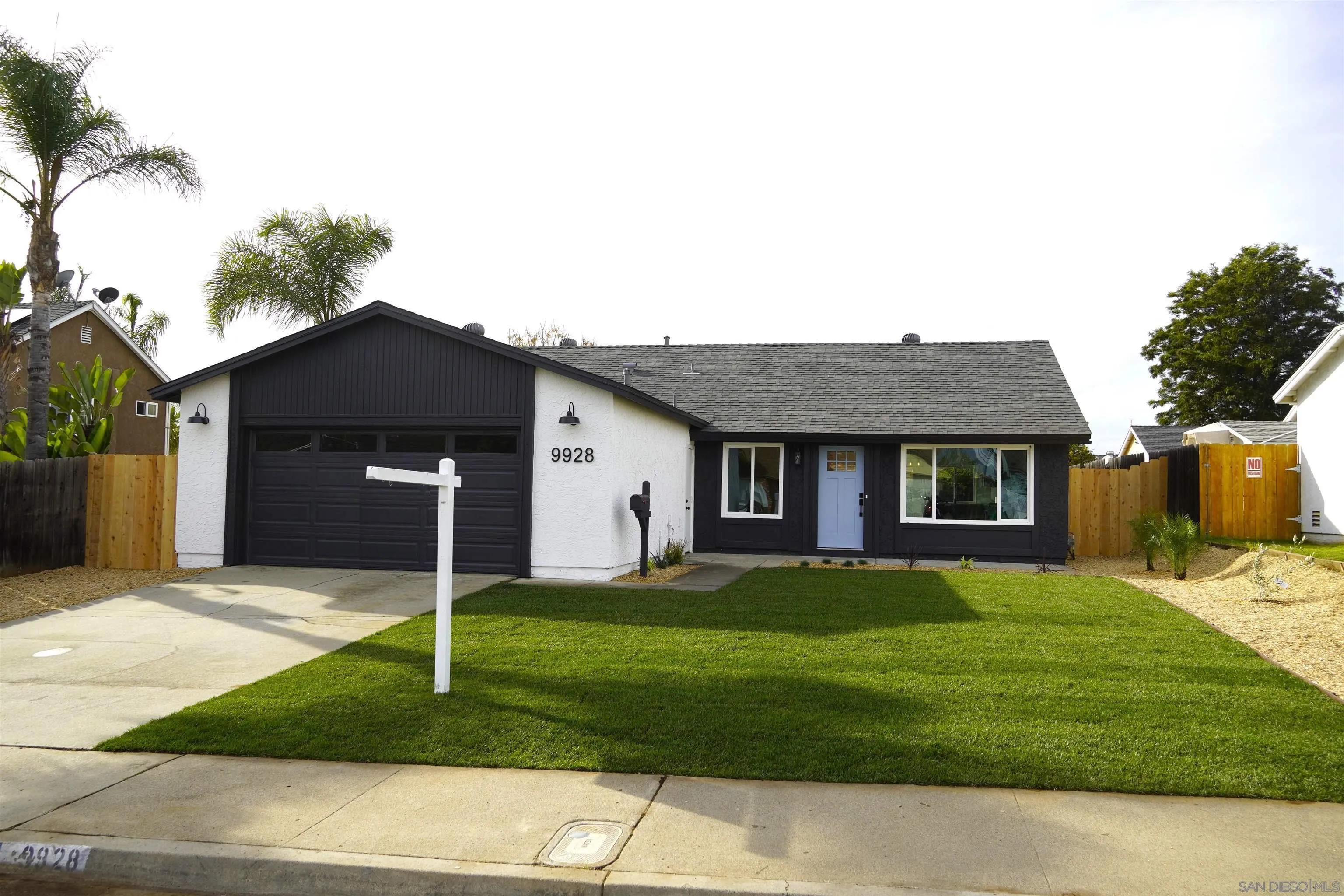 9928 Sadie Street Santee, CA 92071 - Photo 1 of 1 a front view of a house with a yard