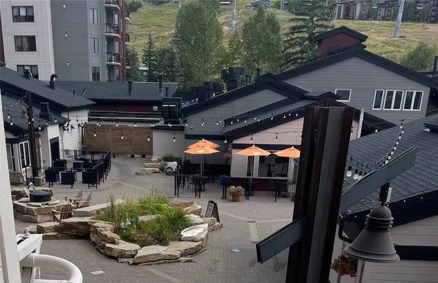 a view of gym equipment and cars parked