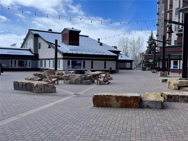 a view of a patio with table and chairs