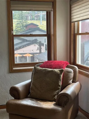 a living room with a couch and a large window