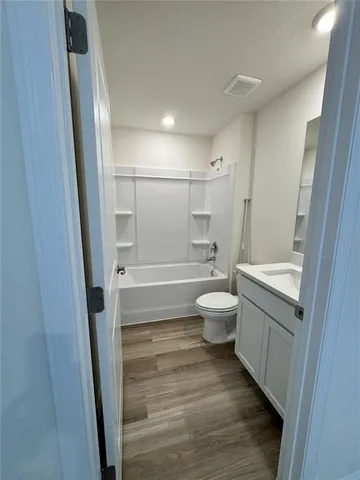 a view of an empty room and a window