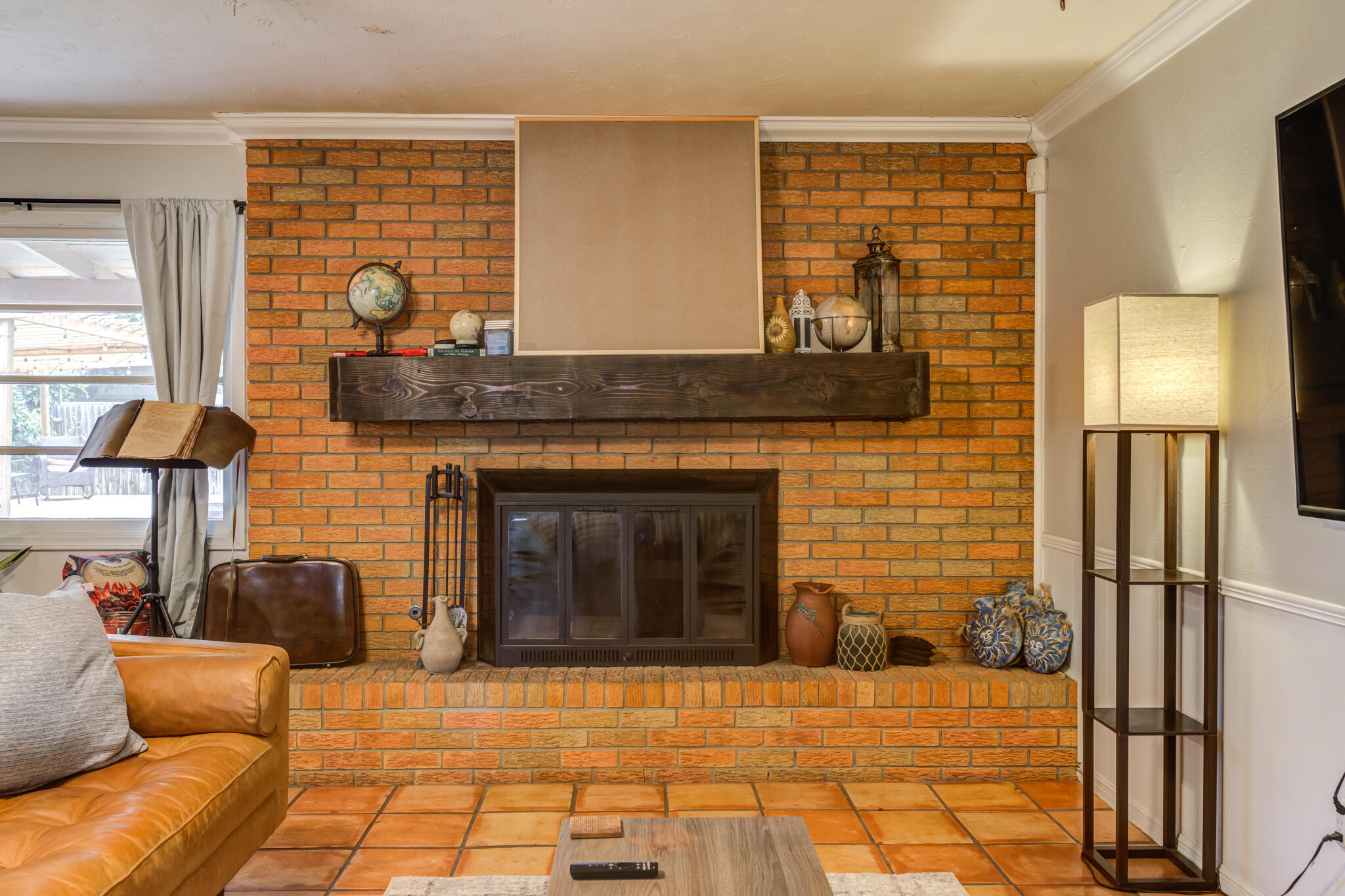 3420 60th Street Lubbock, TX 79413 - Photo 13 of 57 a living room with furniture and a fireplace
