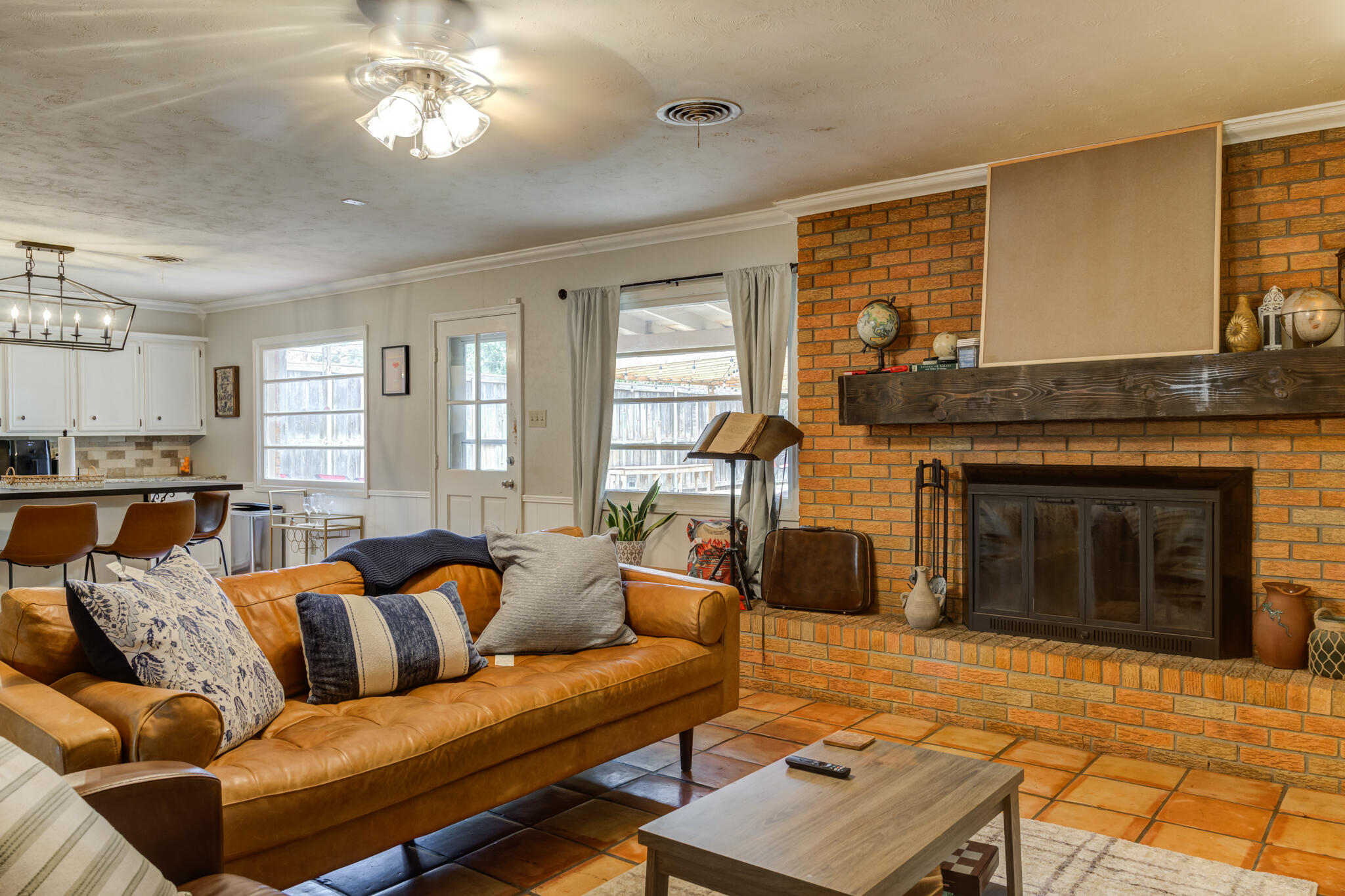 3420 60th Street Lubbock, TX 79413 - Photo 15 of 57 a living room with furniture and a fireplace