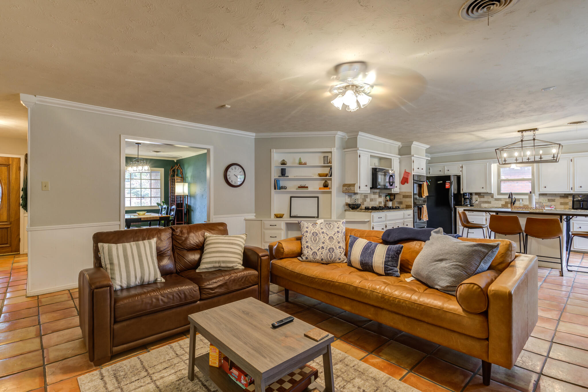 3420 60th Street Lubbock, TX 79413 - Photo 17 of 57 a living room with furniture and a chandelier