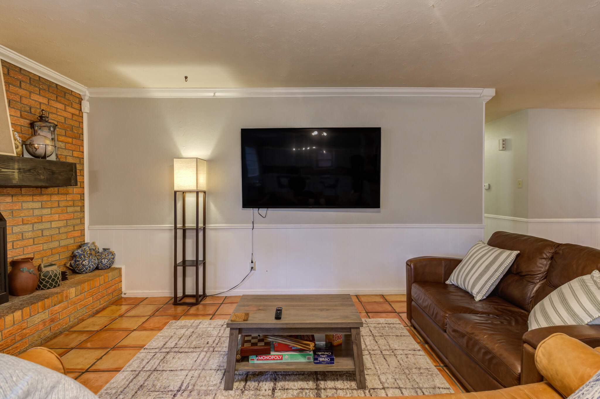 3420 60th Street Lubbock, TX 79413 - Photo 21 of 57 a living room with furniture and a flat screen tv