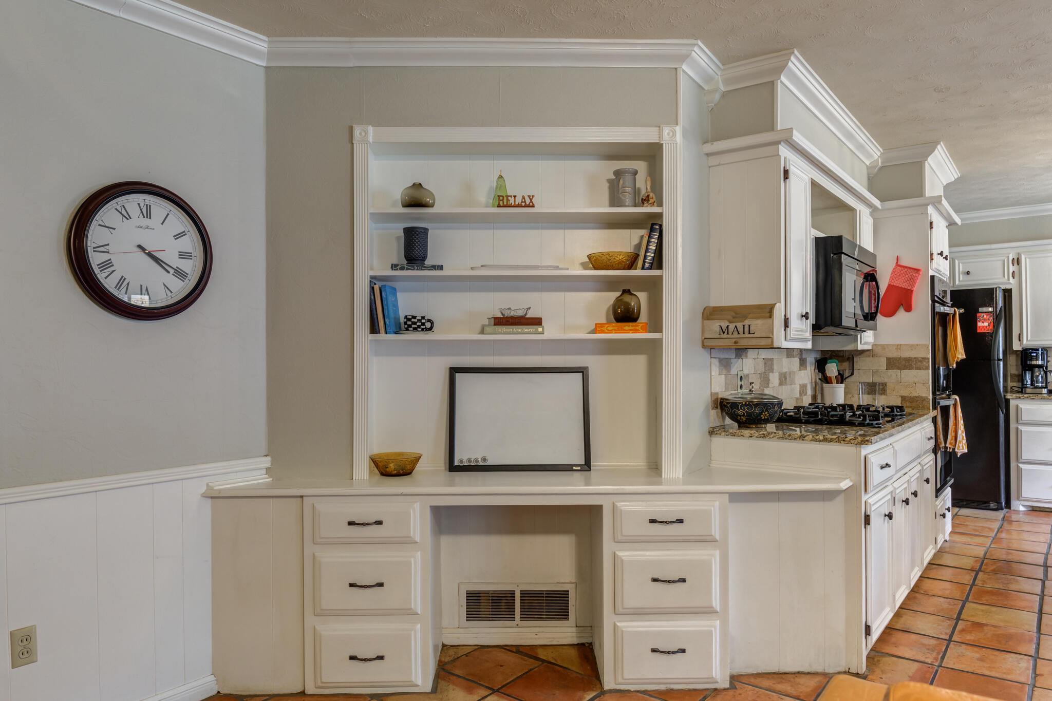 3420 60th Street Lubbock, TX 79413 - Photo 22 of 57 a kitchen with stainless steel appliances cabinets and a window