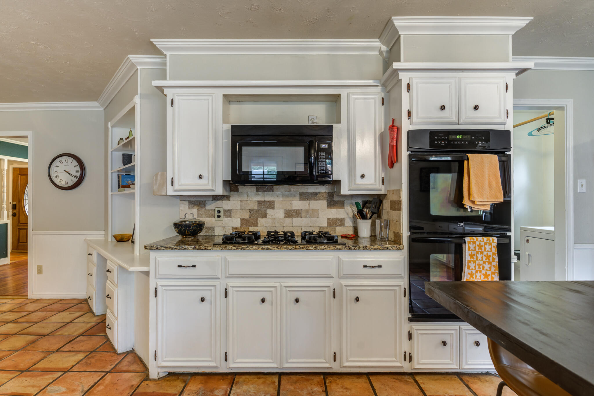 3420 60th Street Lubbock, TX 79413 - Photo 28 of 57 a kitchen with stainless steel appliances white cabinets a stove a sink and a refrigerator