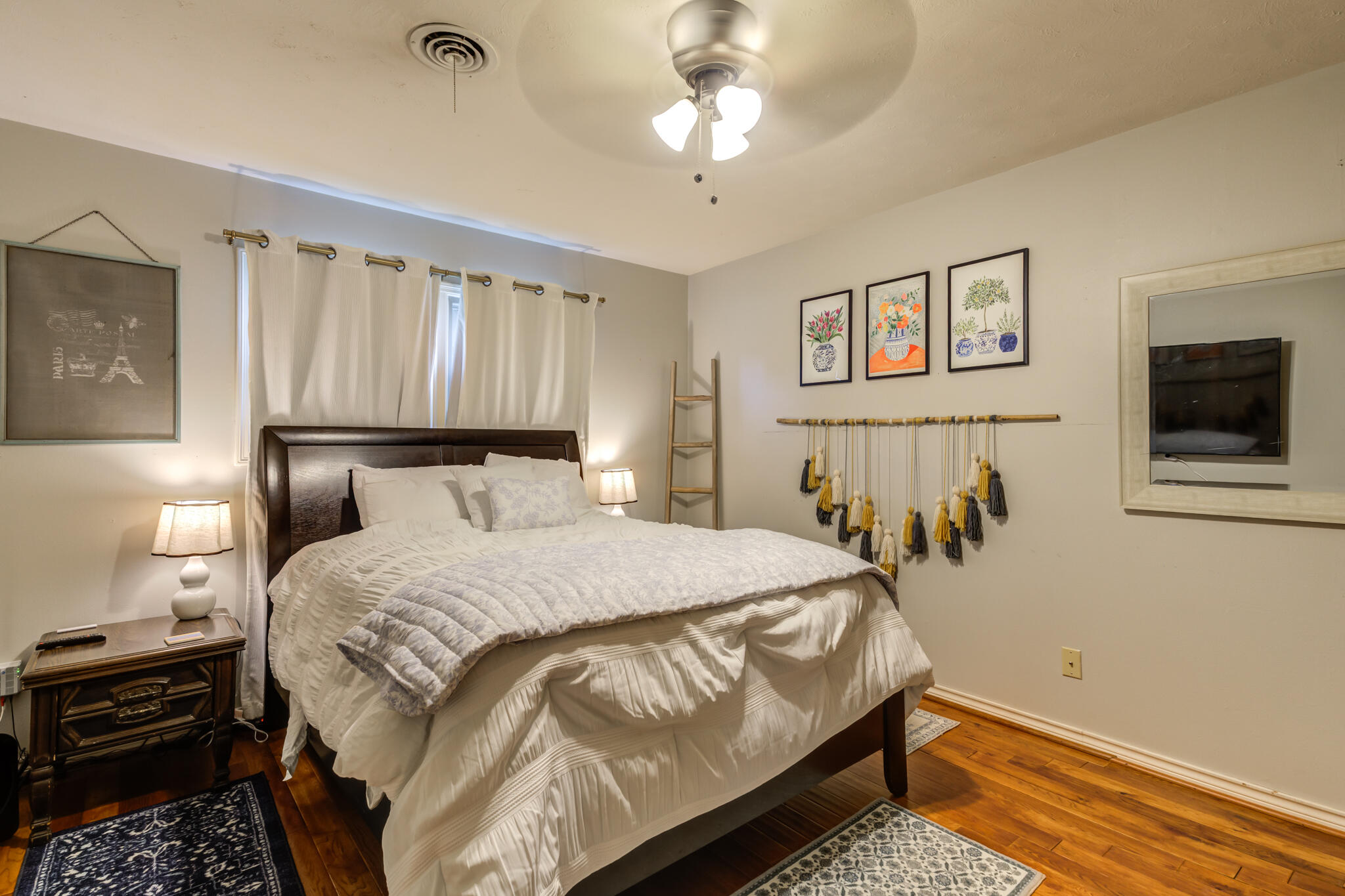 3420 60th Street Lubbock, TX 79413 - Photo 43 of 57 a bedroom with a bed and a tv