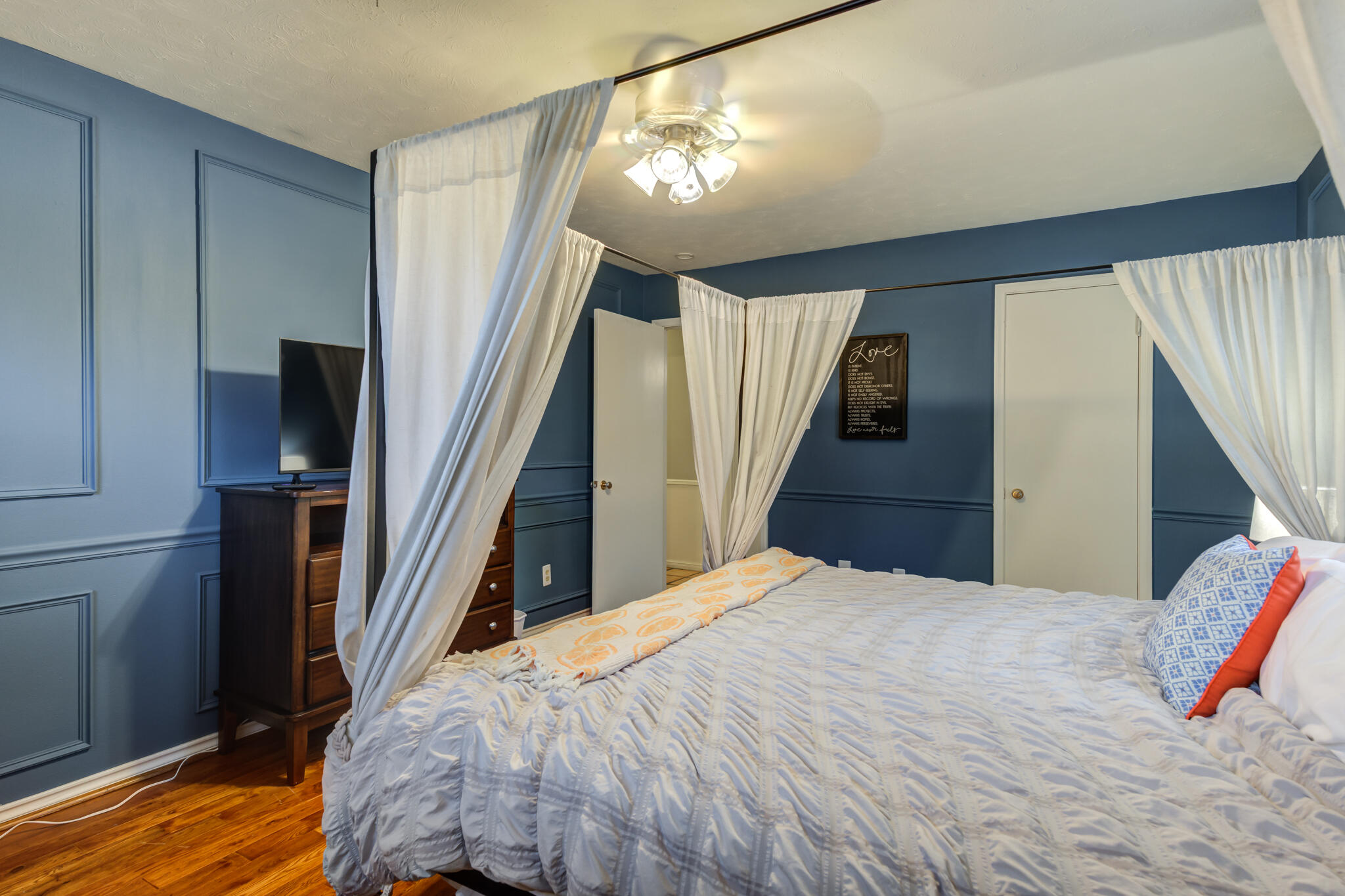 3420 60th Street Lubbock, TX 79413 - Photo 46 of 57 a bedroom with a bed and wooden floor
