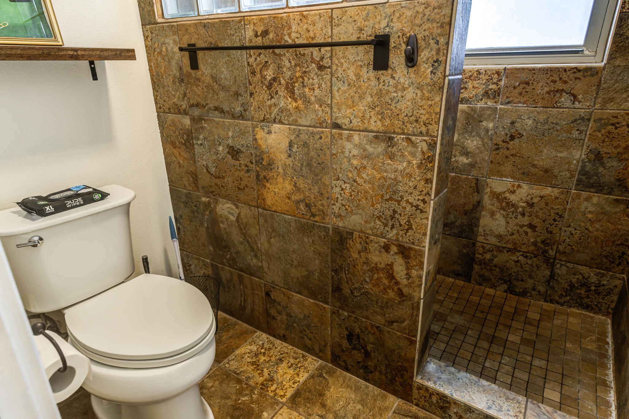 3420 60th Street Lubbock, TX 79413 - Photo 52 of 57 a bathroom with a toilet and a shower
