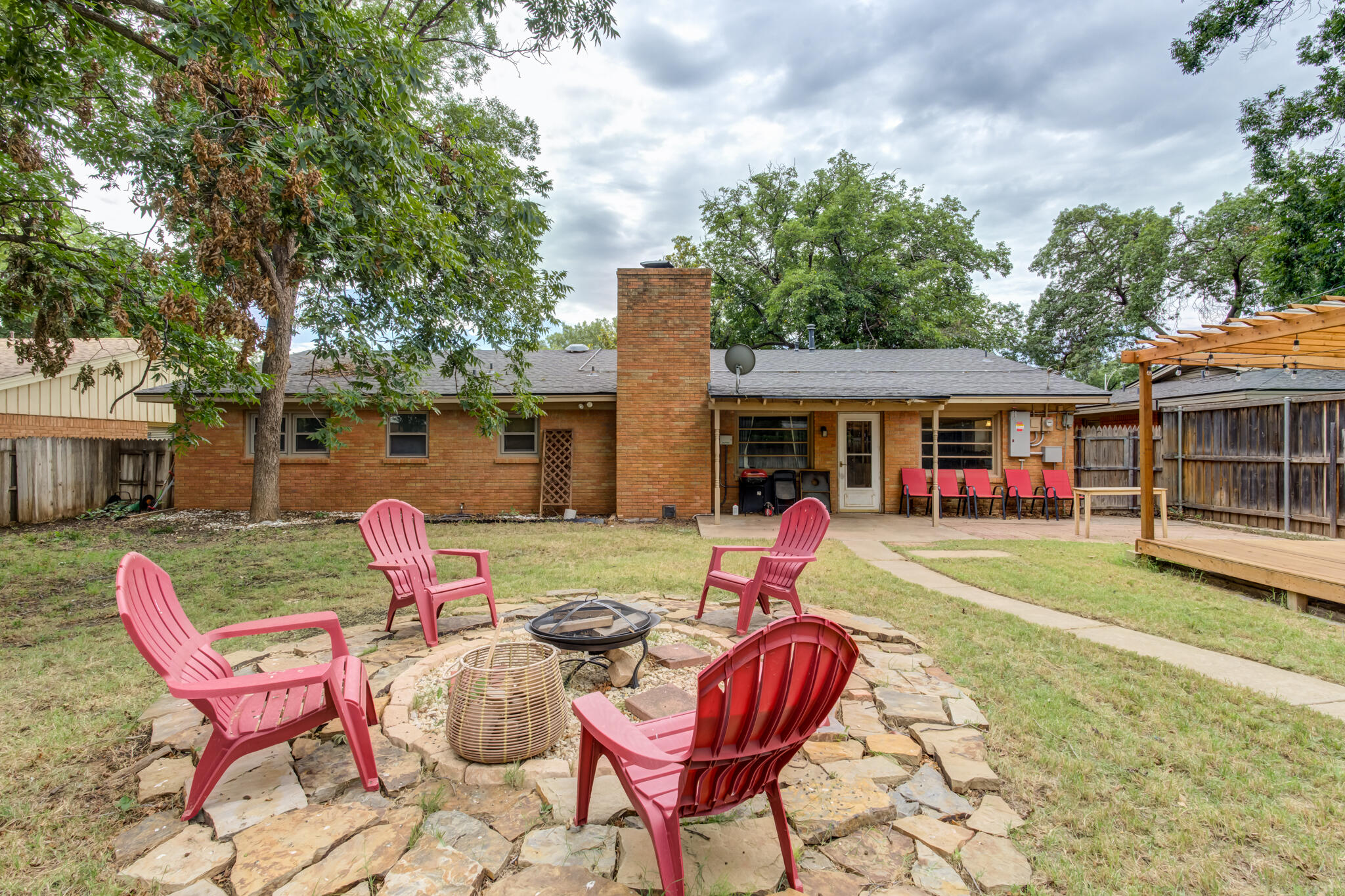 3420 60th Street Lubbock, TX 79413 - Photo 57 of 57 a view of a house with backyard sitting area and garden