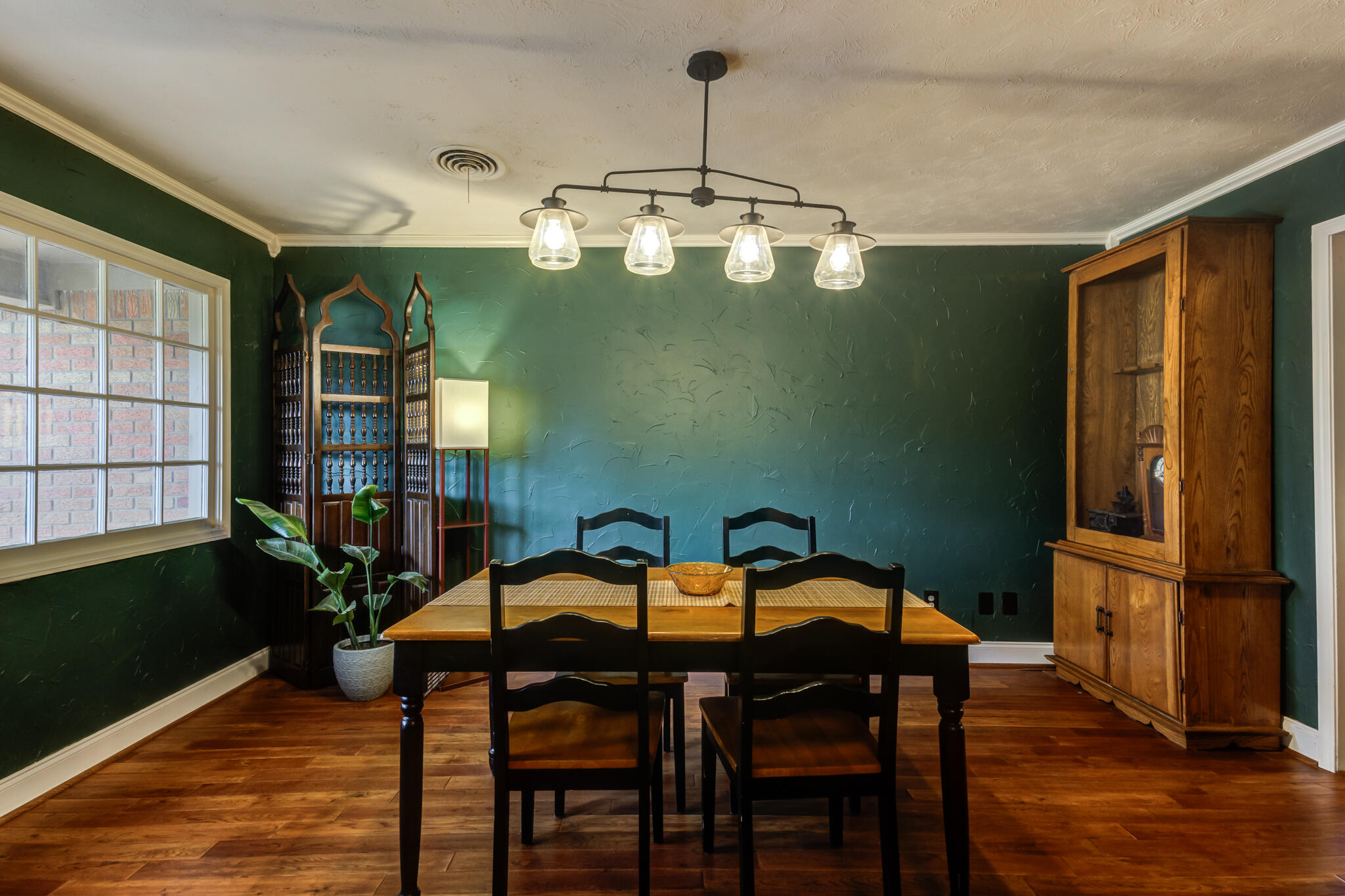 3420 60th Street Lubbock, TX 79413 - Photo 6 of 57 a view of a dining room with furniture window and wooden floor