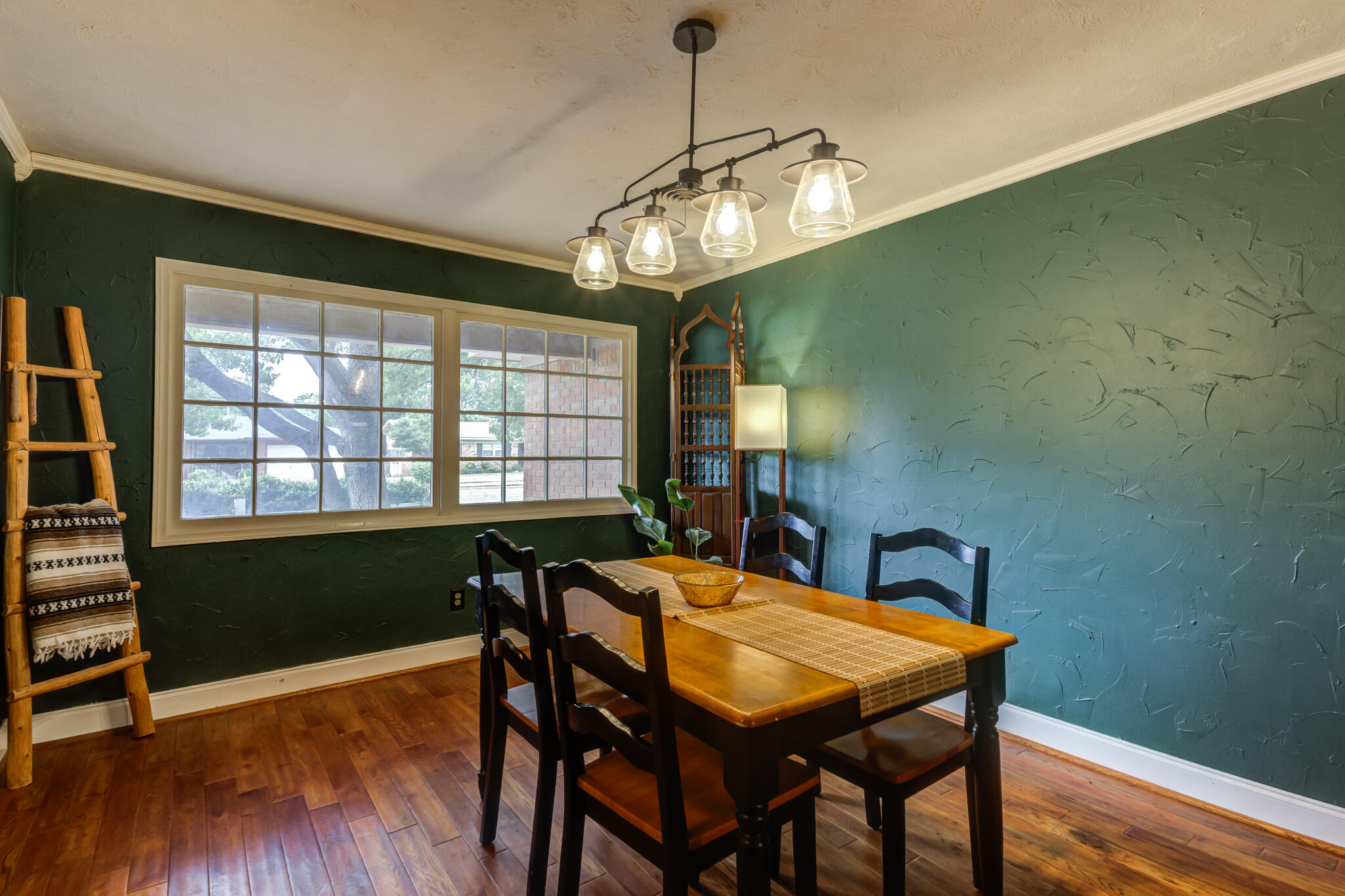 3420 60th Street Lubbock, TX 79413 - Photo 7 of 57 a view of a dining room with furniture window and wooden floor
