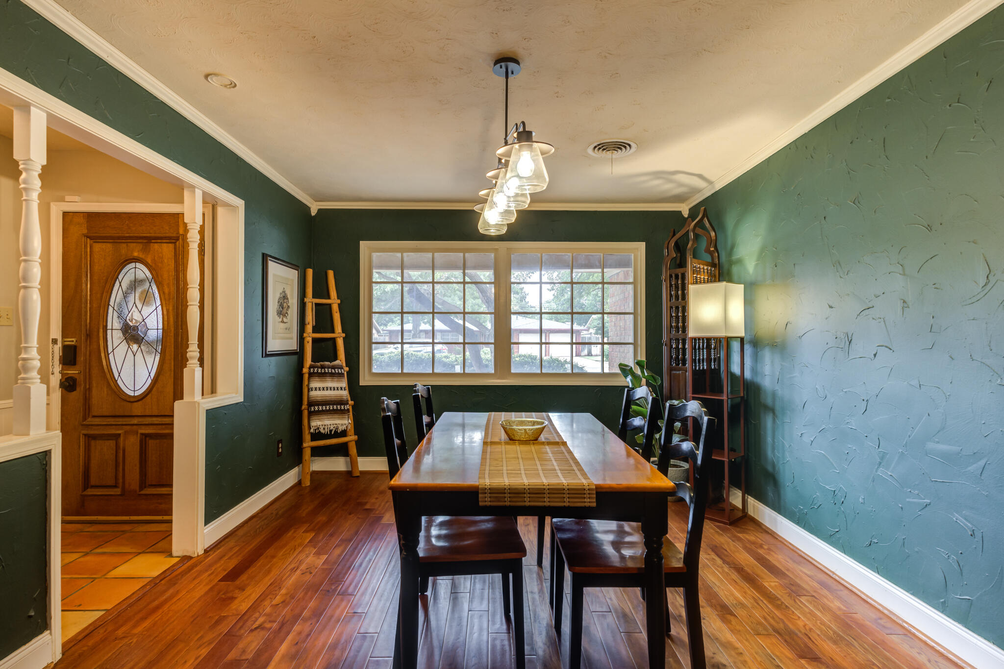 3420 60th Street Lubbock, TX 79413 - Photo 8 of 57 a view of a dining room with furniture window and wooden floor