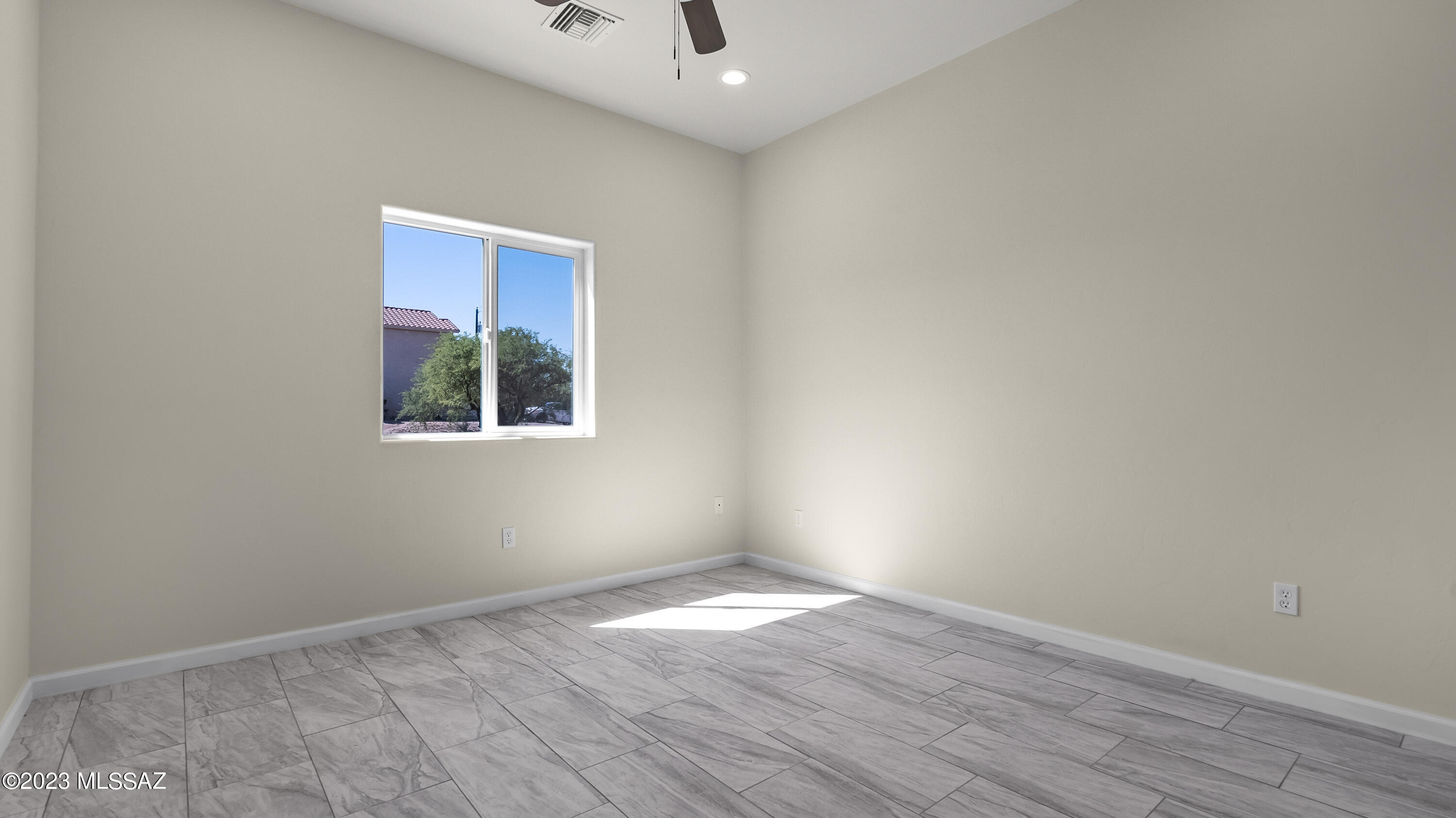 1799 Saltillo Court Rio Rico, AZ 85648 - Photo 10 of 25 a view of empty room with wooden floor