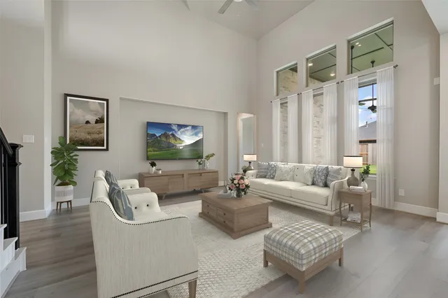 a large kitchen with stainless steel appliances kitchen island a large counter top and a wooden floors