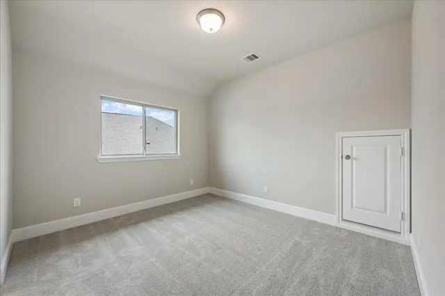 a bathroom with a granite countertop sink a toilet and a large mirror