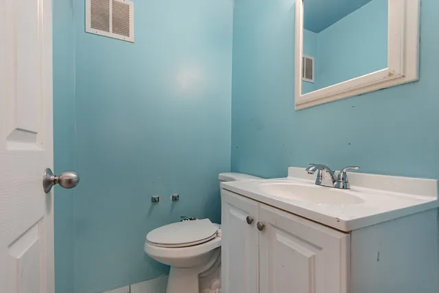 a bathroom with a sink and a toilet