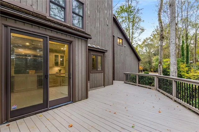a view of balcony with furniture and wooden floor