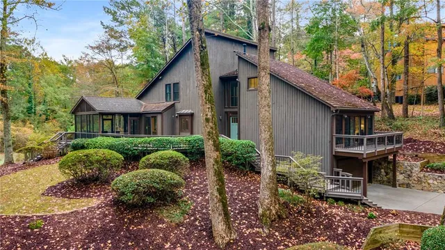 a view of a swimming pool with a yard