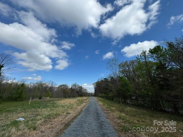 2015 C Avenue Charlotte, NC 28216 - Photo 17 of 25 a view of a pathway both side of grassy field with shrub