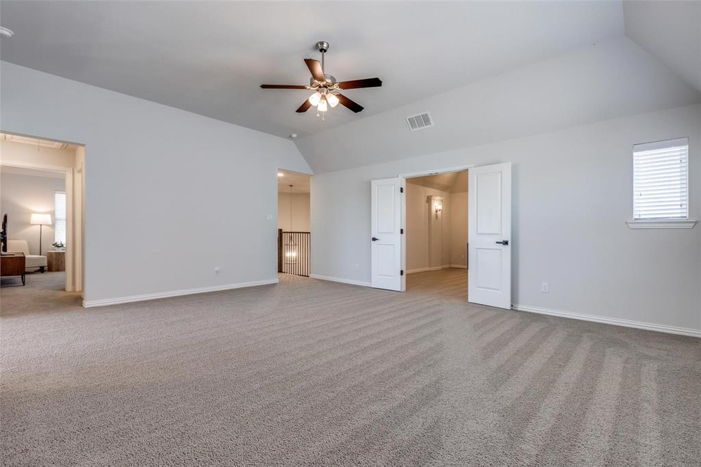 1000 Adair Road Prosper, TX 75078 - Photo 26 of 38 HUGE game room leading into the over sized media so the kiddos can enjoy their favorite movie... MAYBE you can even get in there to relax and enjoy it as well.