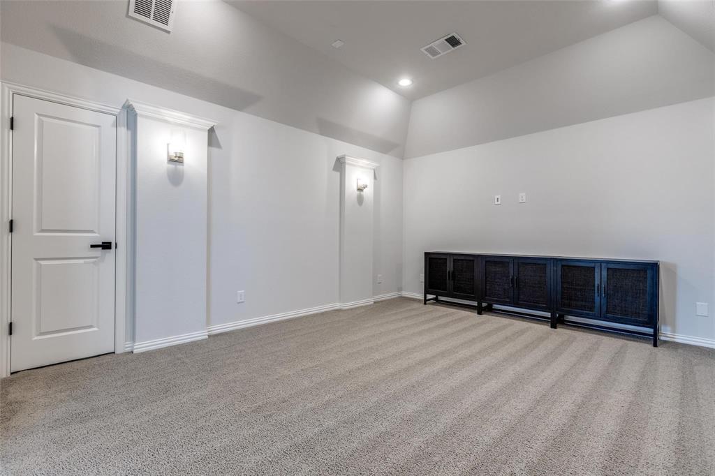 1000 Adair Road Prosper, TX 75078 - Photo 28 of 38 Oversized media room that is prewired for sound and video.