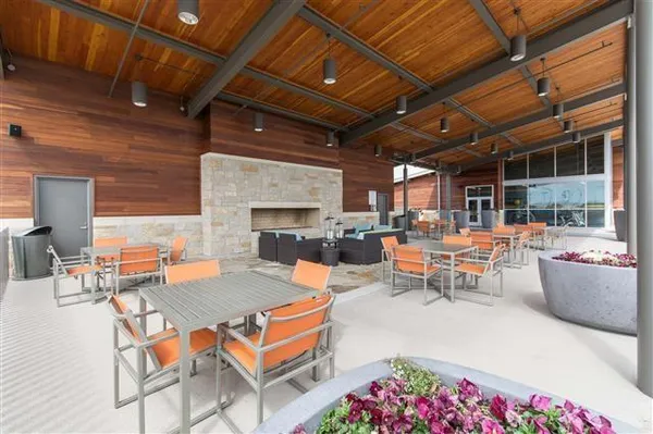 a outdoor space with tables and chairs