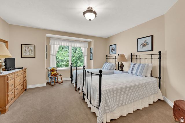 7740 Keswick Road Sandy, UT 84093 - Photo 35 of 74 Room featuring a bay window with natural light, neutral wall colors, and a ceiling-mounted fixture