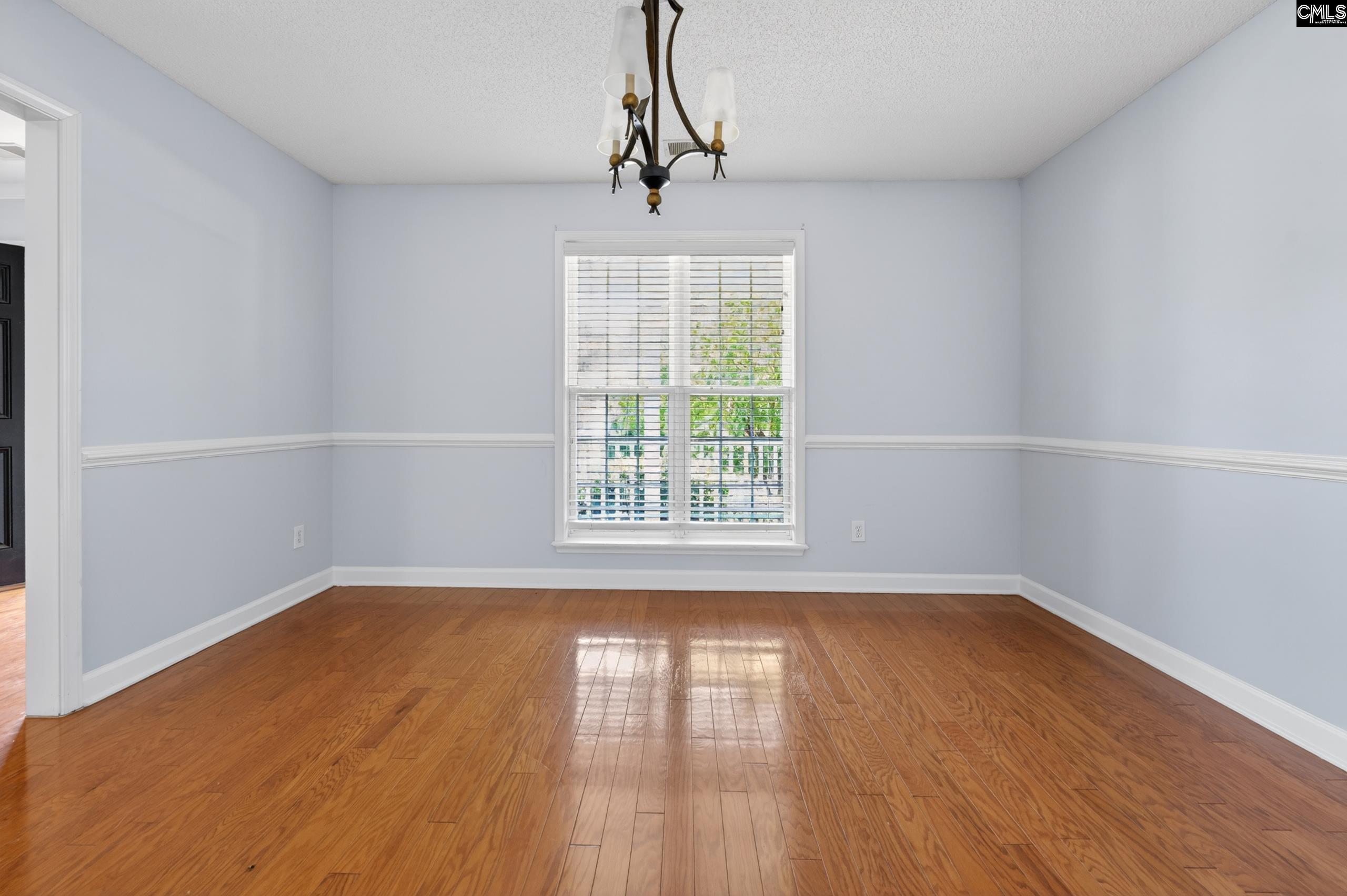 219 Plantation Pointe Drive Elgin, SC 29045 - Photo 27 of 56 a view of an empty room with wooden floor and a window