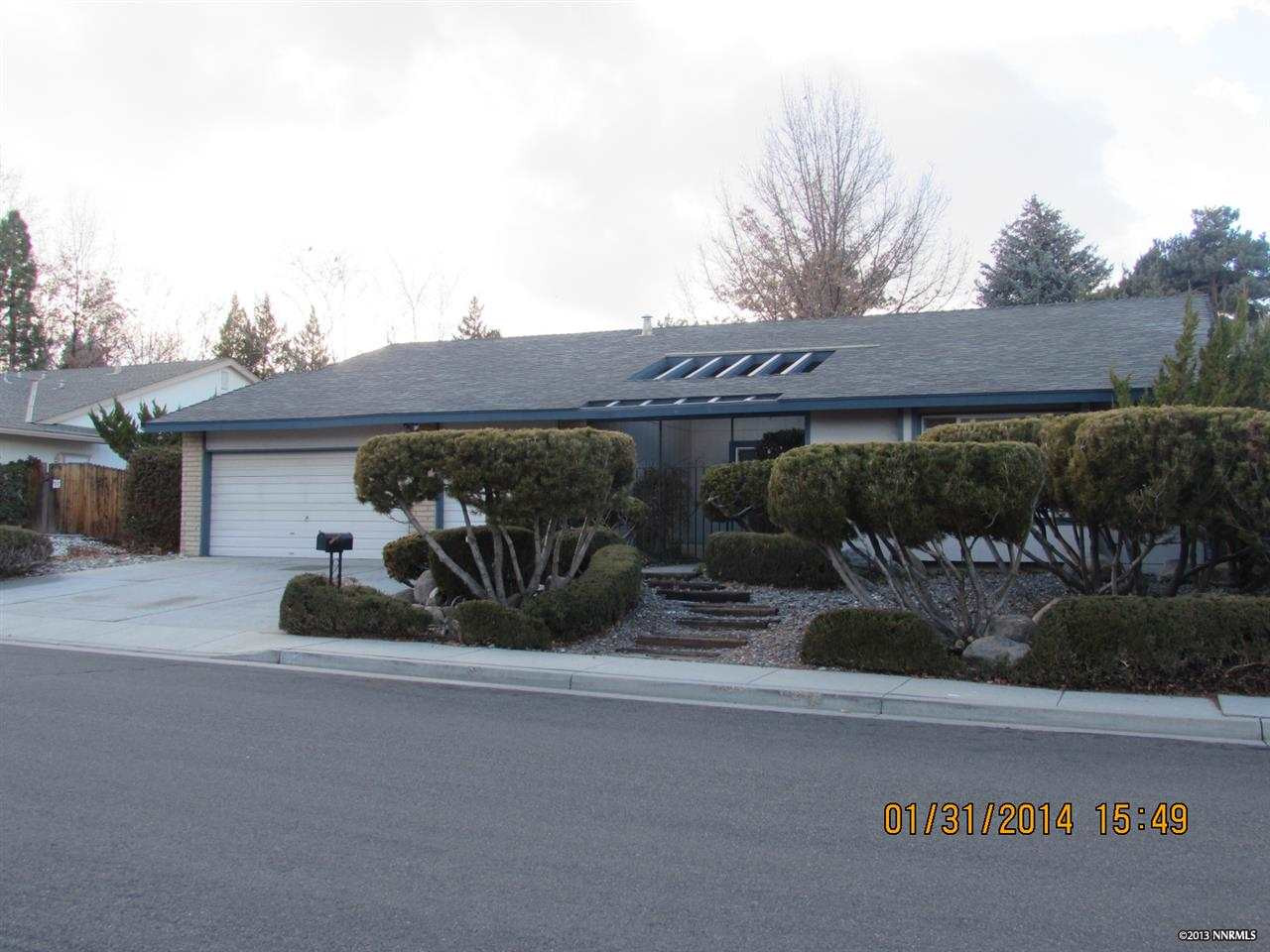 4875 Cool Springs Drive Reno, NV 89509 - Photo 1 of 1 a front view of a house with garden