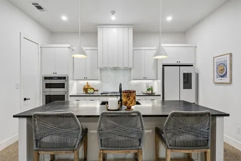 a kitchen with a stove and a sink