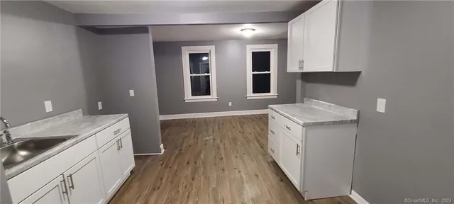 a bathroom with a sink and a window