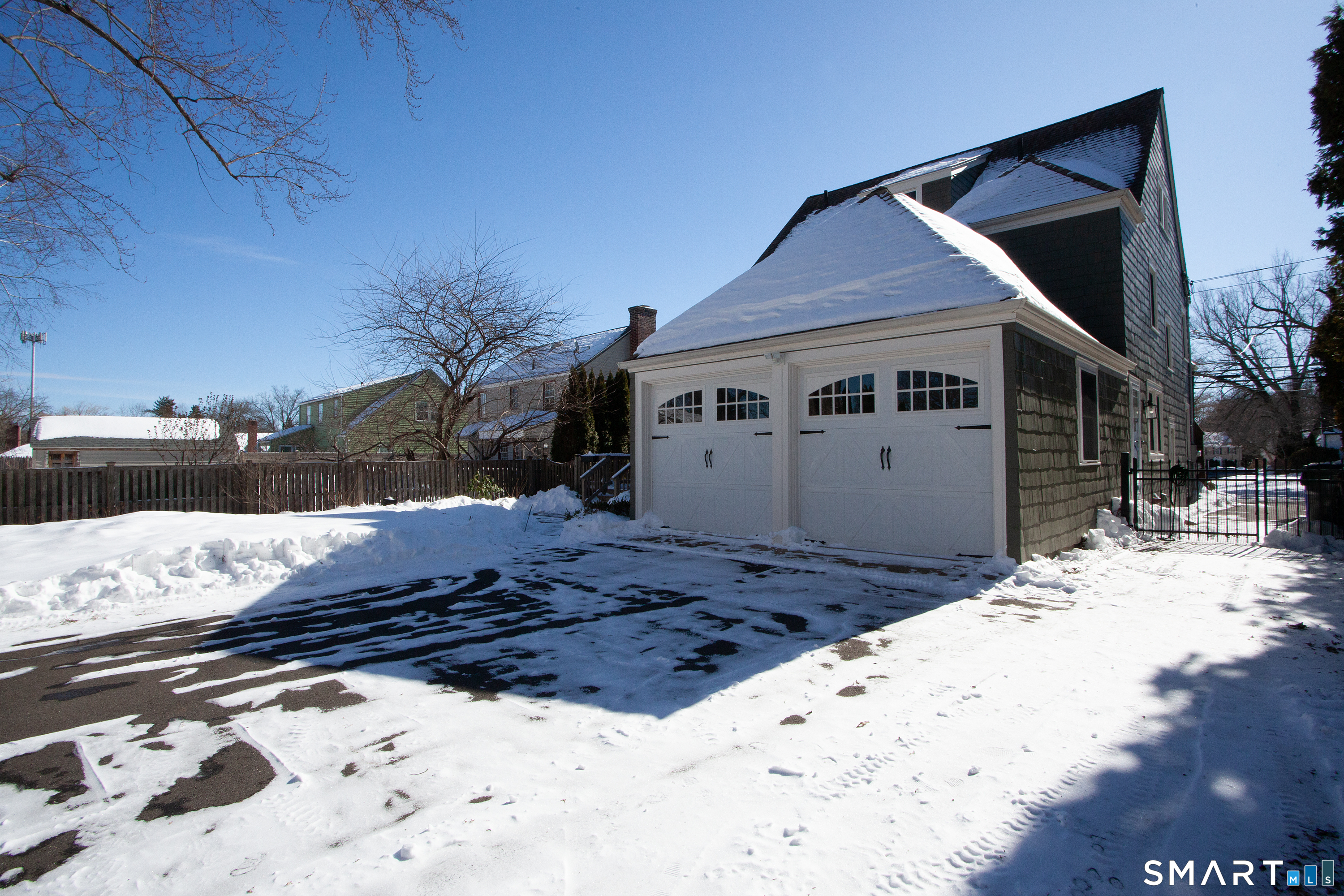 30 Sedgwick Road West Hartford, CT 06107 - Photo 38 of 40 The rear driveway and back yard are entirely fenced in providing a safe space for pets or children