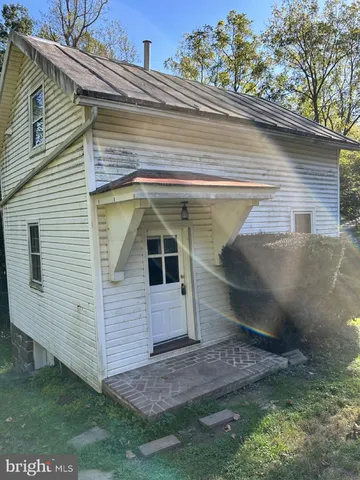 a view of walk in closet and window