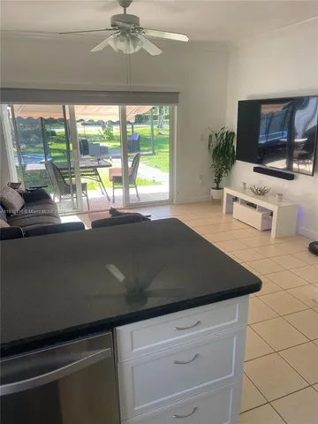 a view of an empty room with a fireplace