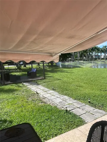 a view of swimming pool with outdoor seating