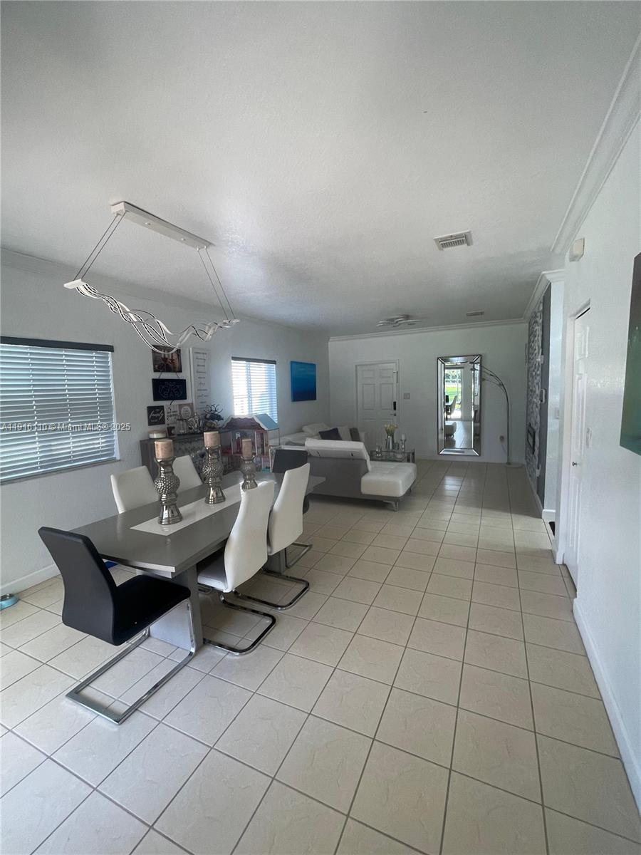 3102 Northeast 3rd Drive Homestead, FL 33033 - Photo 2 of 33 a living room with furniture