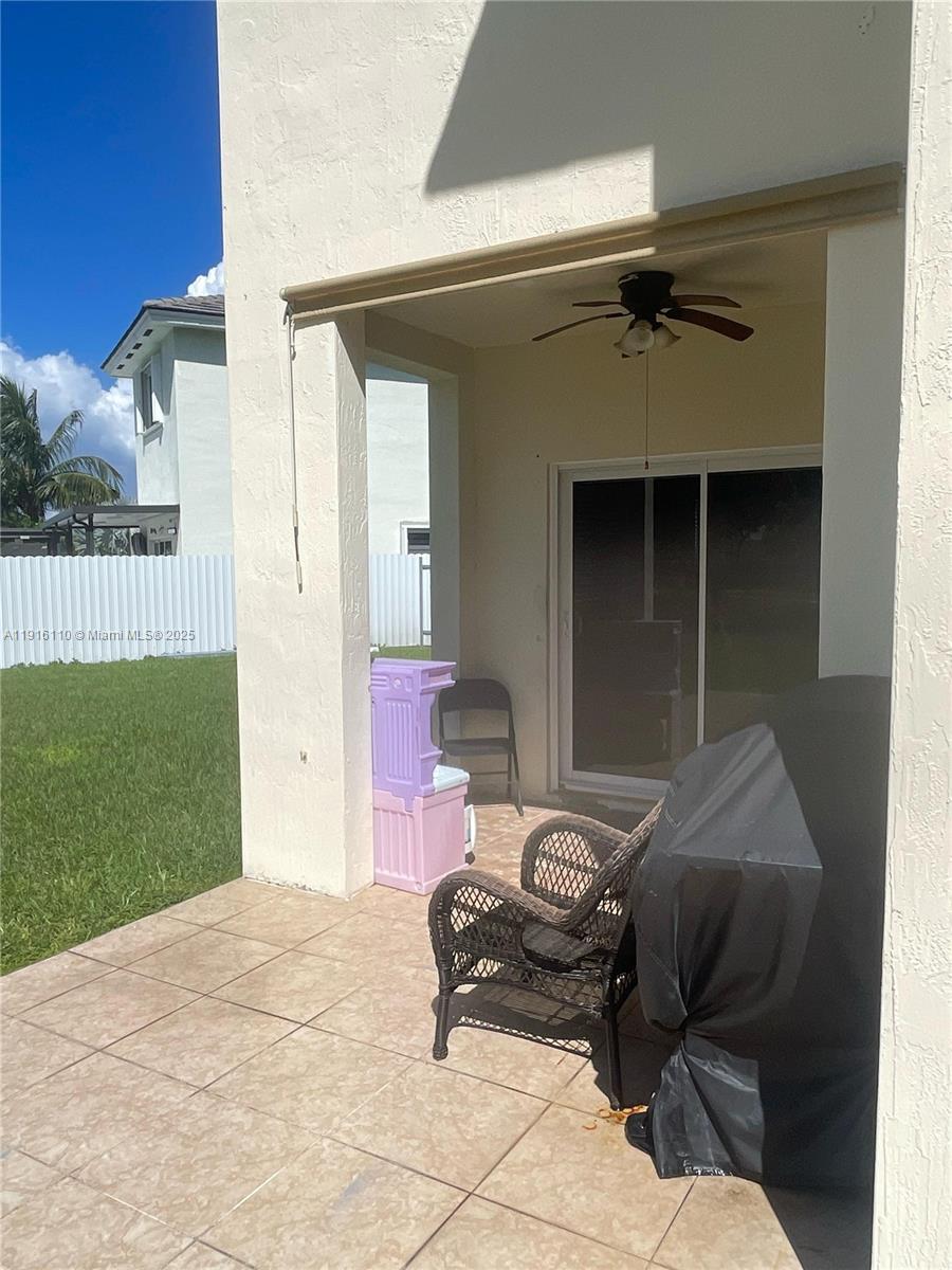 3102 Northeast 3rd Drive Homestead, FL 33033 - Photo 24 of 33 a bedroom with a bed and a window