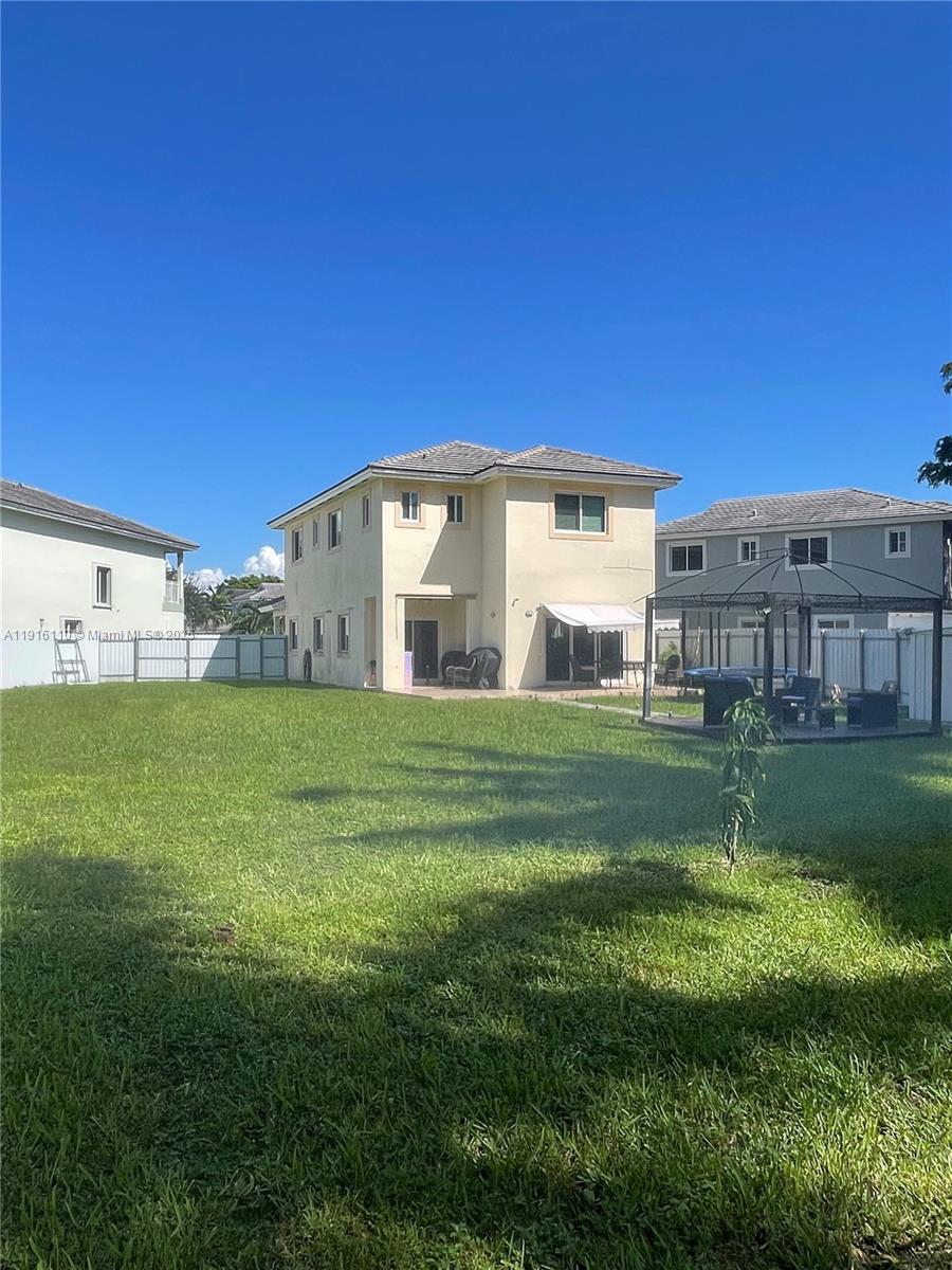 3102 Northeast 3rd Drive Homestead, FL 33033 - Photo 26 of 33 a view of a house with a big yard