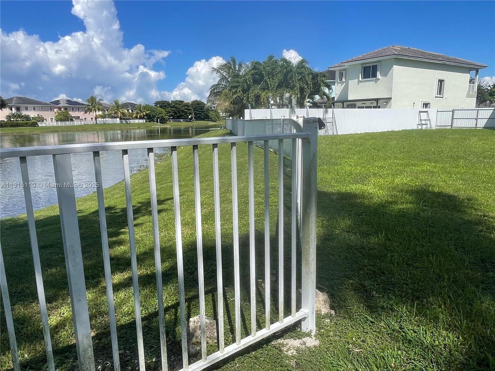 3102 Northeast 3rd Drive Homestead, FL 33033 - Photo 28 of 33 a view of a house with a yard from a balcony