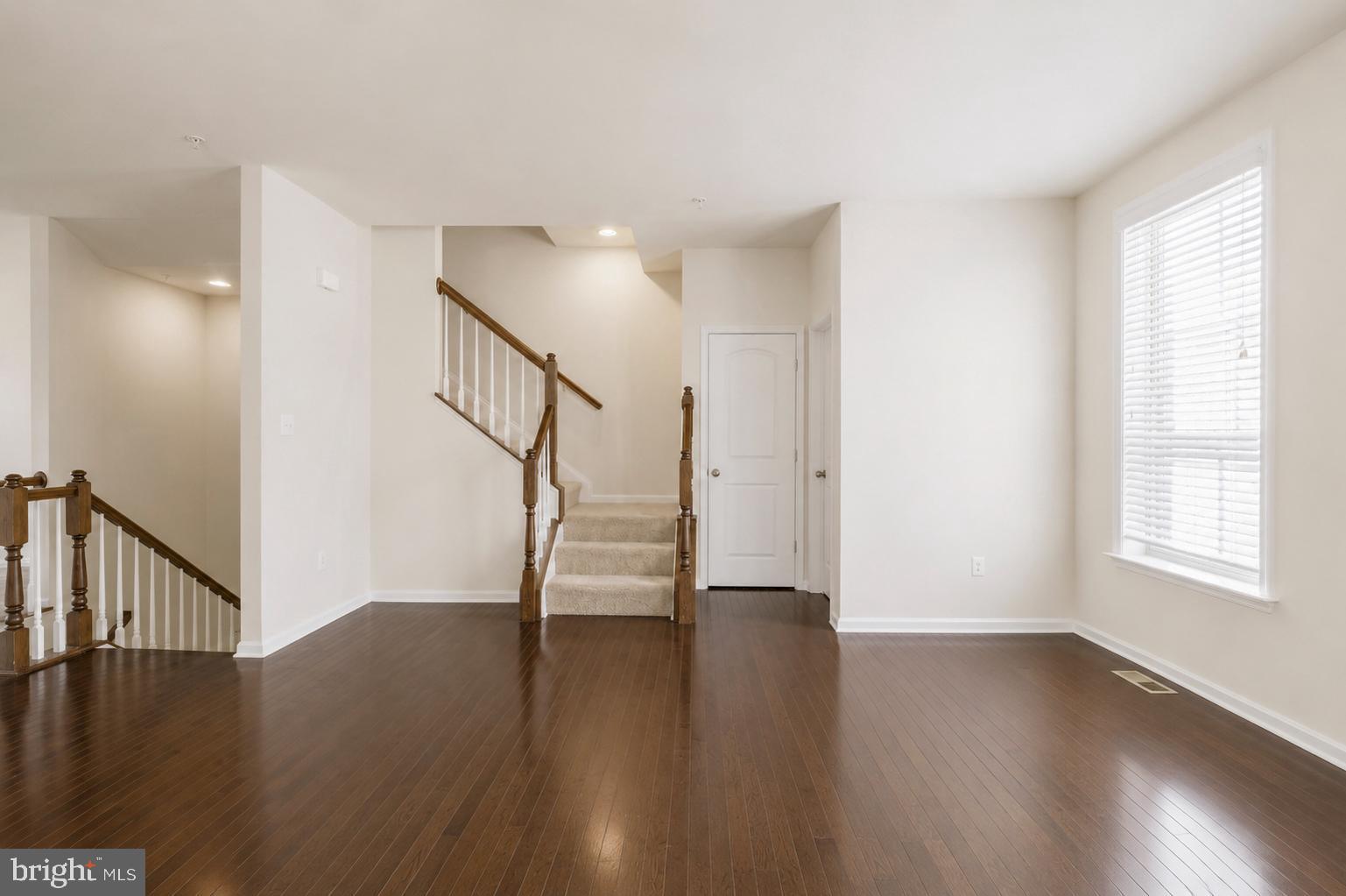 4731 Cambria Road Frederick, MD 21703 - Photo 27 of 63 a view of entryway with wooden floor and stairs