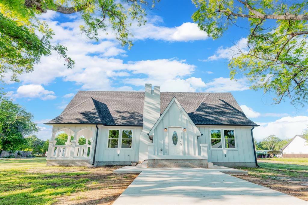 front view of a house with a yard