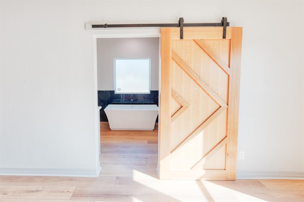 808 North Main Street Tioga, TX 76271 - Photo 14 of 23 a bathroom with a sink and a mirror