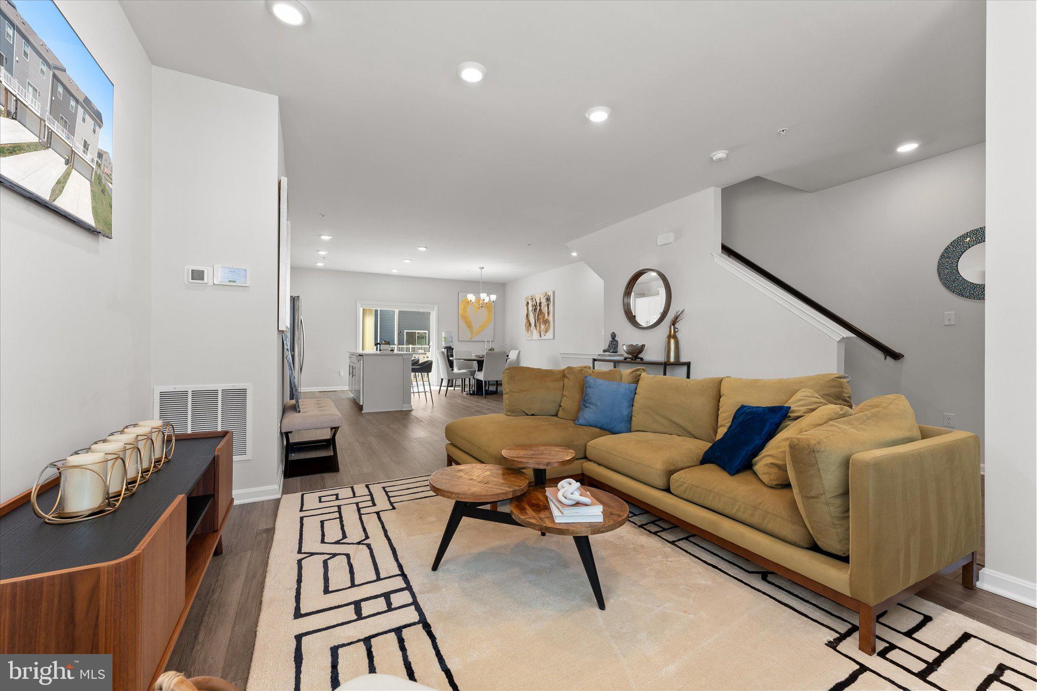 9611 Silver Bluff Way Bowie, MD 20721 - Photo 15 of 33 a living room with furniture and wooden floor