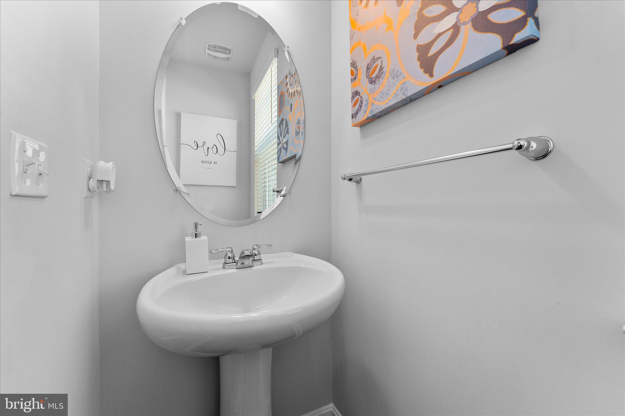 9611 Silver Bluff Way Bowie, MD 20721 - Photo 17 of 33 a bathroom with a sink and a mirror