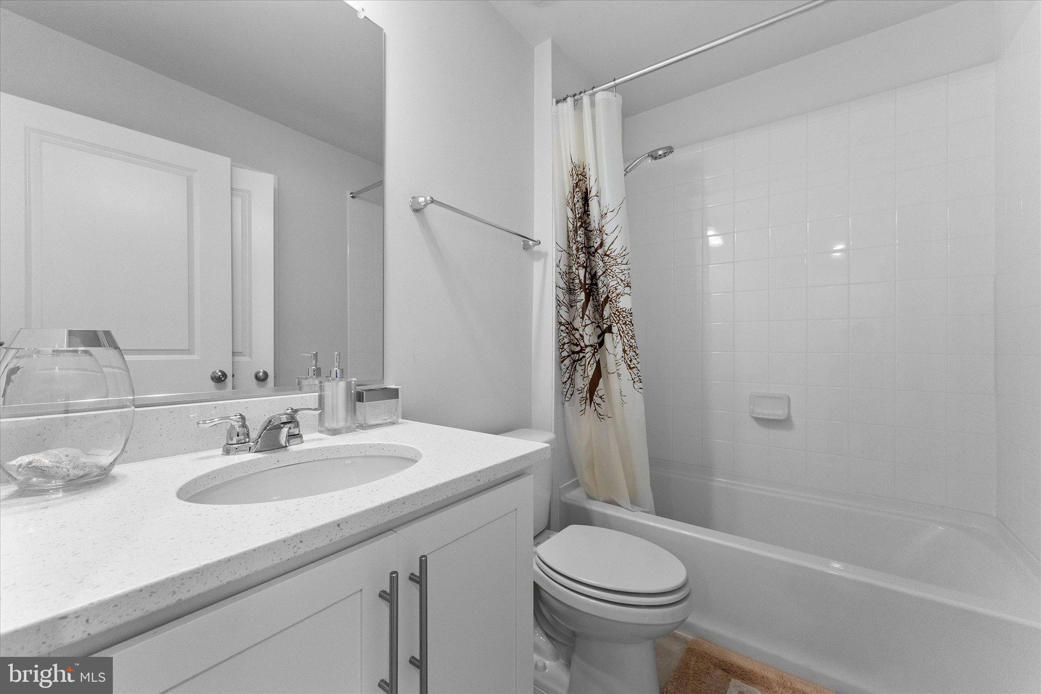 9611 Silver Bluff Way Bowie, MD 20721 - Photo 27 of 33 a bathroom with a sink toilet and shower