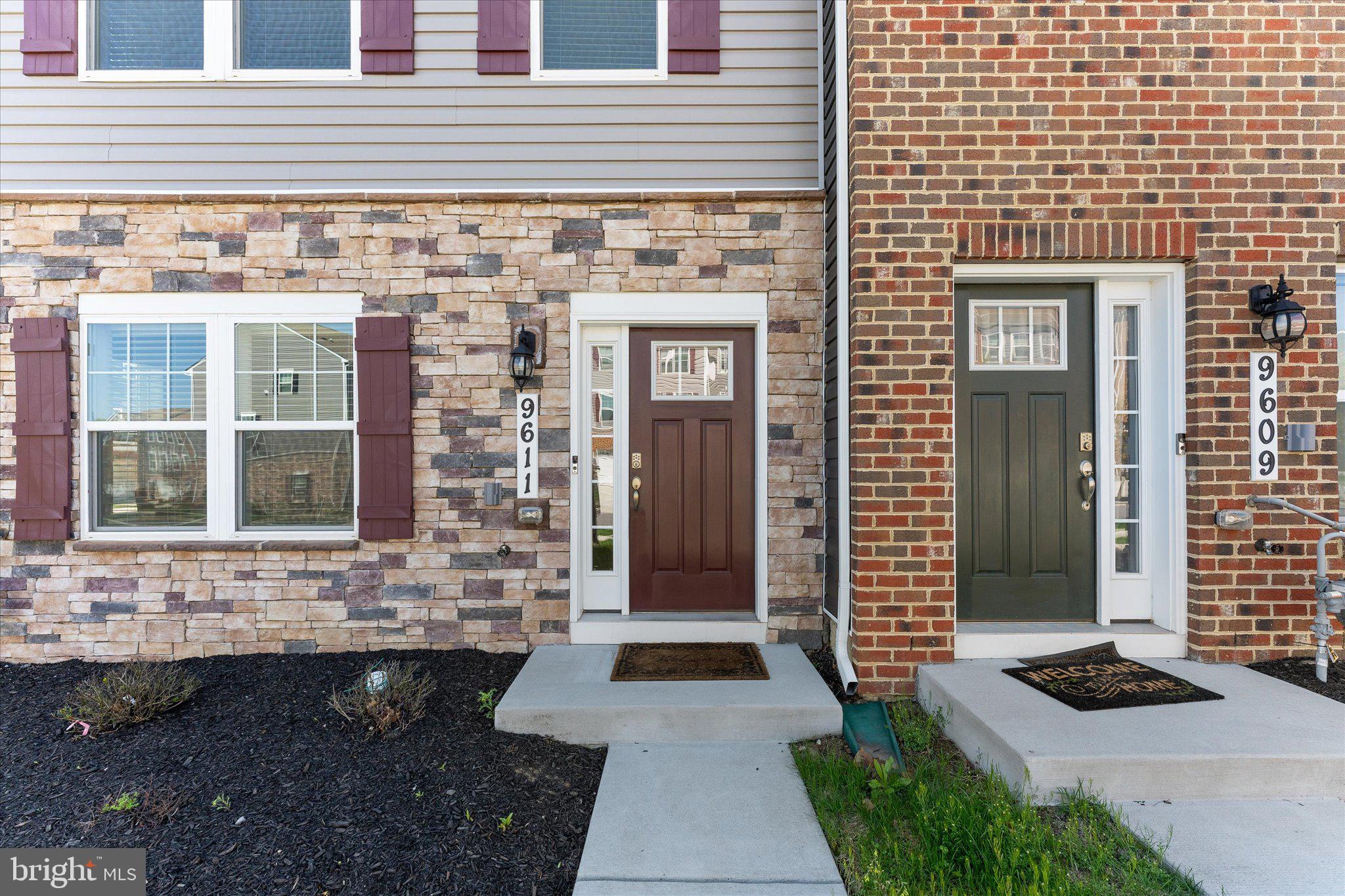 9611 Silver Bluff Way Bowie, MD 20721 - Photo 3 of 33 a front view of a house with a yard